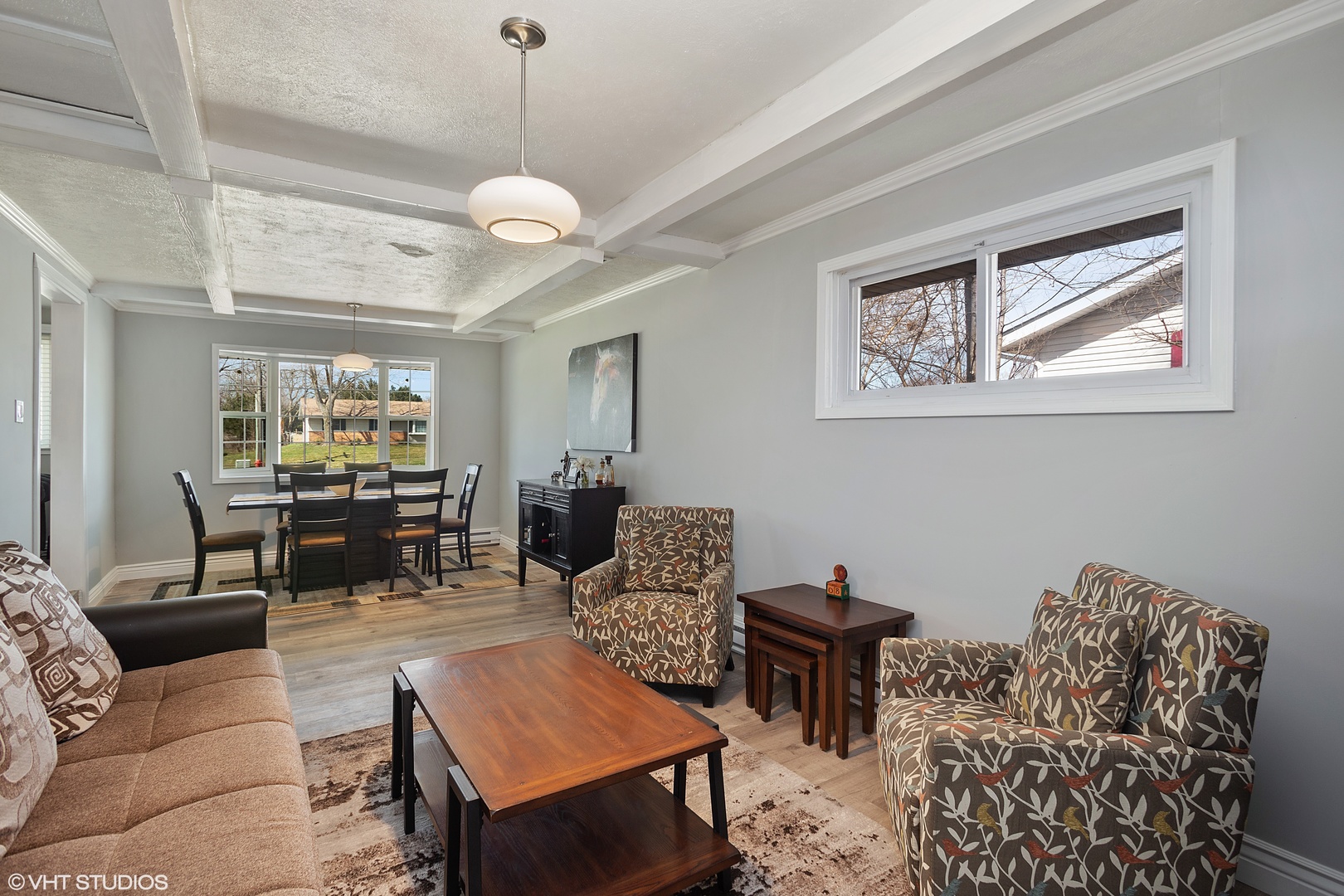 323 Springinsguth Road Schaumburg, IL 60193 - Photo 5 of 14 a living room with furniture a rug and a chandelier