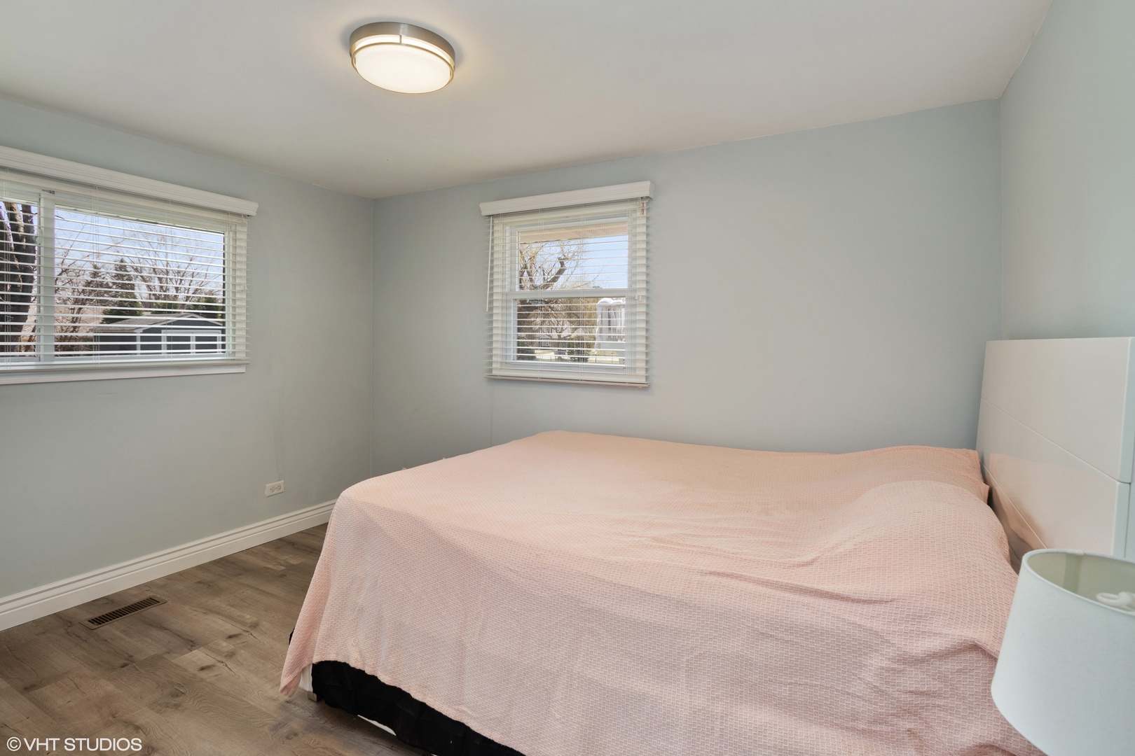 323 Springinsguth Road Schaumburg, IL 60193 - Photo 7 of 14 a bedroom with a bed and a window