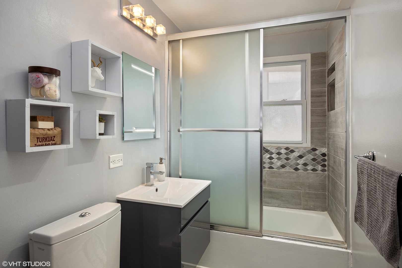 323 Springinsguth Road Schaumburg, IL 60193 - Photo 9 of 14 a bathroom with a shower a mirror and a sink