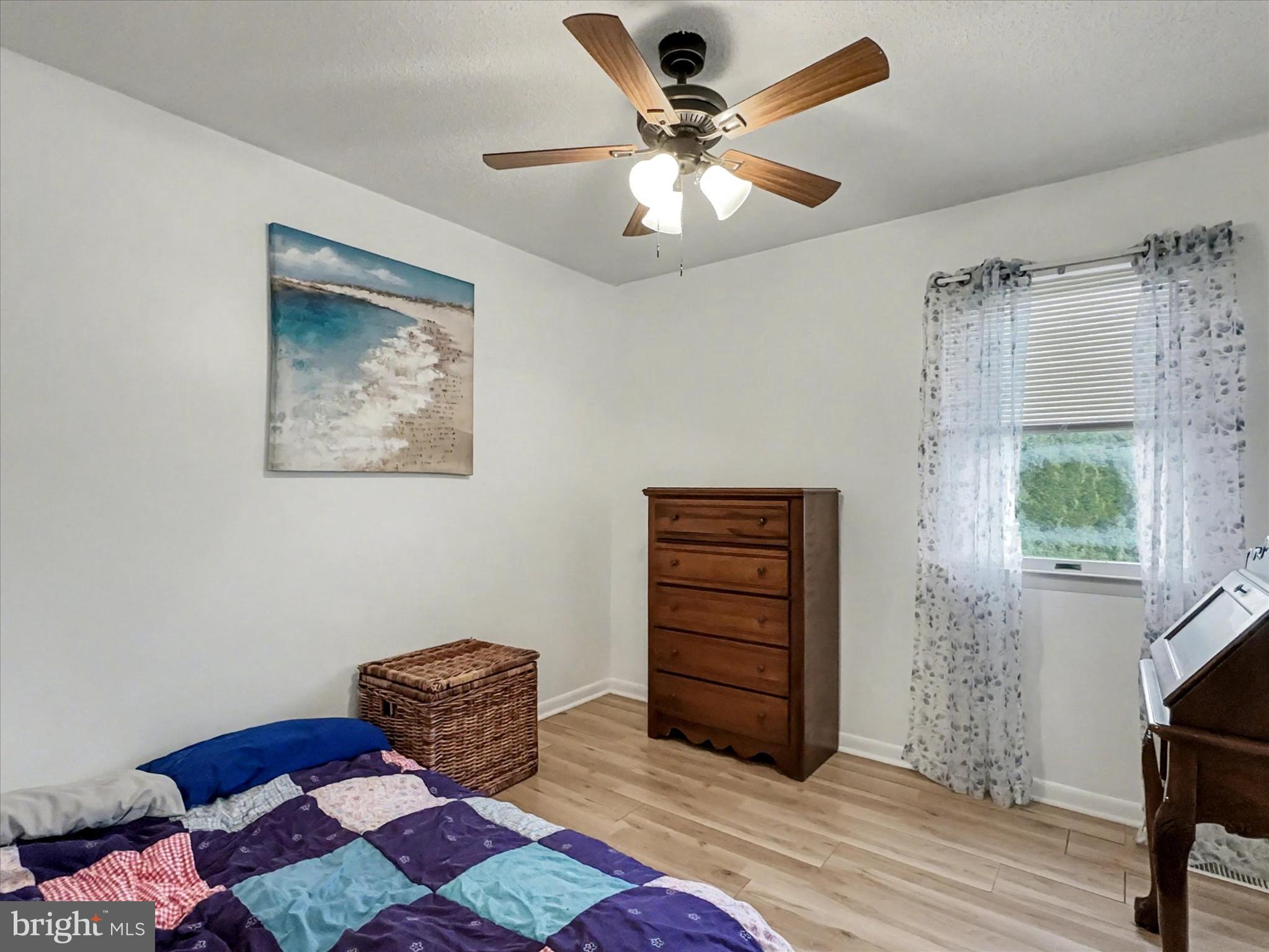 123 Overview Circle East Red Lion, PA 17356 - Photo 16 of 23 a bedroom with a bed and a chandelier