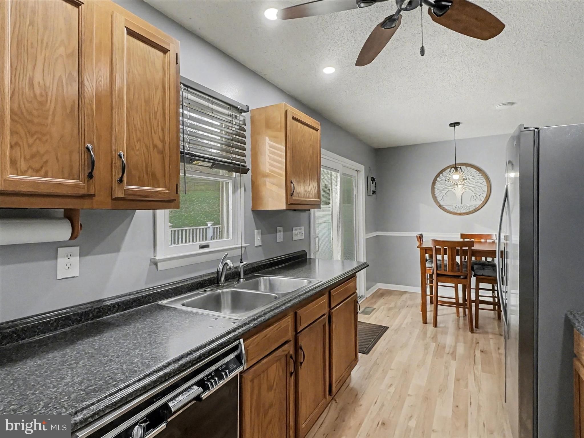123 Overview Circle East Red Lion, PA 17356 - Photo 6 of 23 a kitchen with stainless steel appliances granite countertop a sink a stove counter space and cabinets