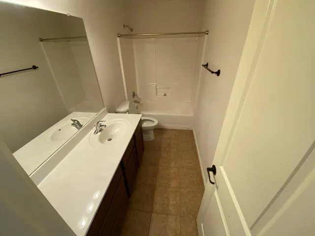a utility room with a sink a washer and dryer