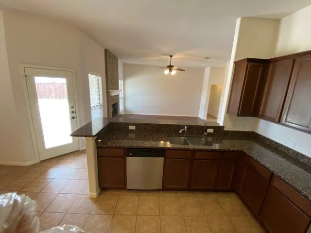 a view of a kitchen with a sink