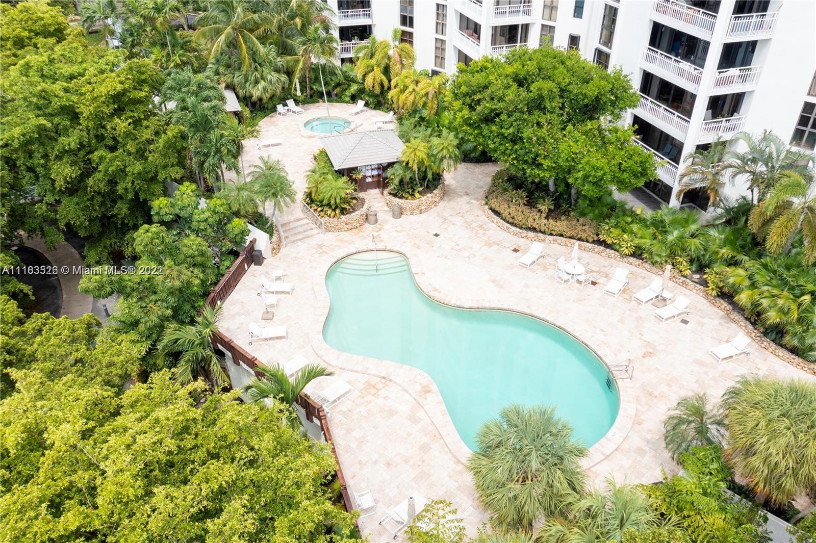 1000 Quayside Terrace, Unit 1205 Miami, FL 33138 - Photo 4 of 12 a view of a swimming pool with a yard and trees