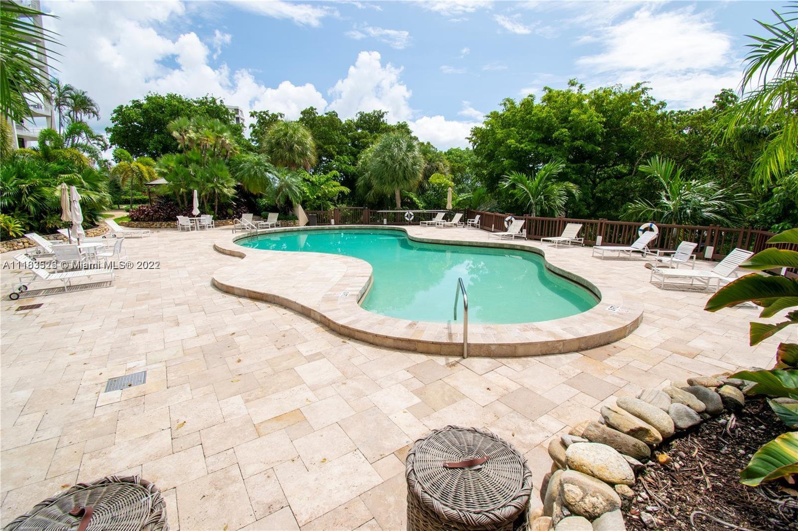 1000 Quayside Terrace, Unit 1205 Miami, FL 33138 - Photo 8 of 12 a view of a swimming pool with lounge chair