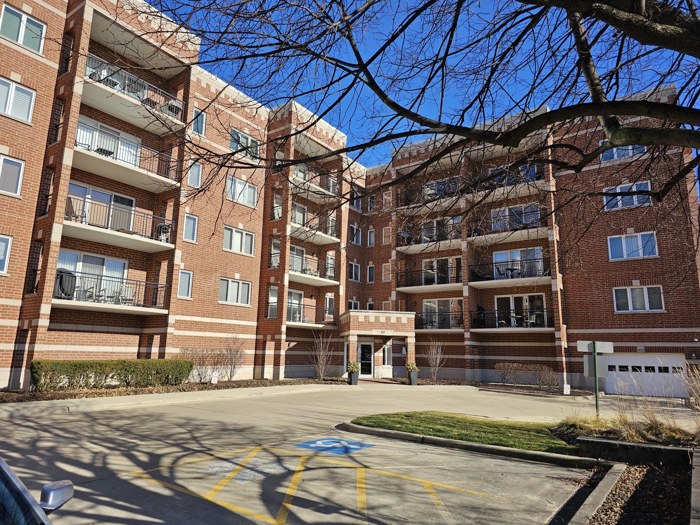a view of a brick building with many windows