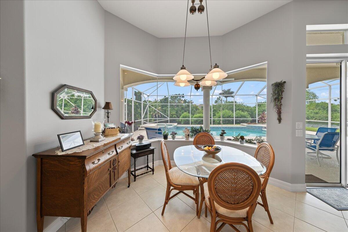 4300 Stoney Point Road Melbourne, FL 32940 - Photo 16 of 37 a view of a dining room and furniture window and outside view