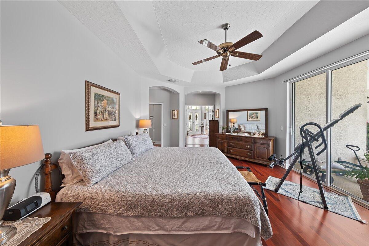 4300 Stoney Point Road Melbourne, FL 32940 - Photo 19 of 37 a bedroom with a bed and a flat screen tv