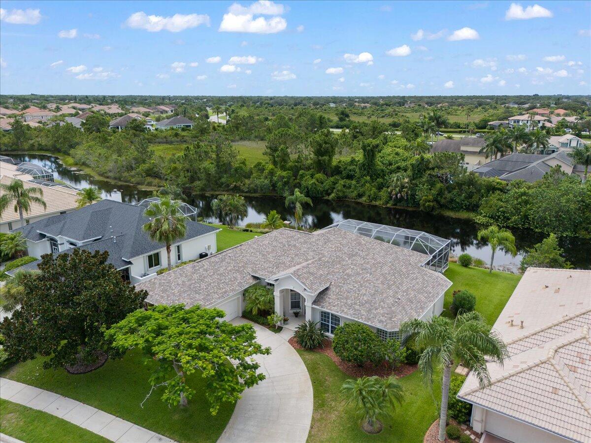 4300 Stoney Point Road Melbourne, FL 32940 - Photo 27 of 37 an aerial view of a house with a yard and lake view