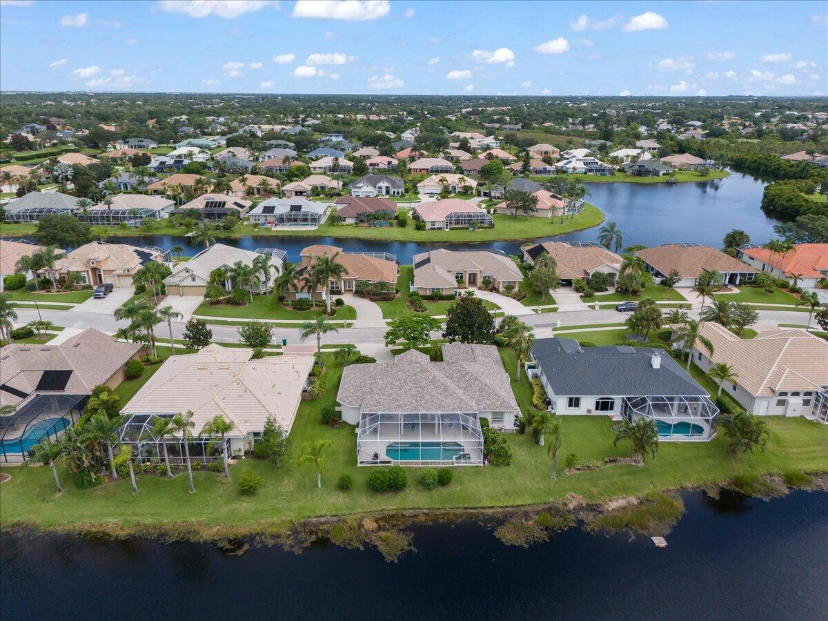 4300 Stoney Point Road Melbourne, FL 32940 - Photo 30 of 37 an aerial view of residential houses with outdoor space and lake view
