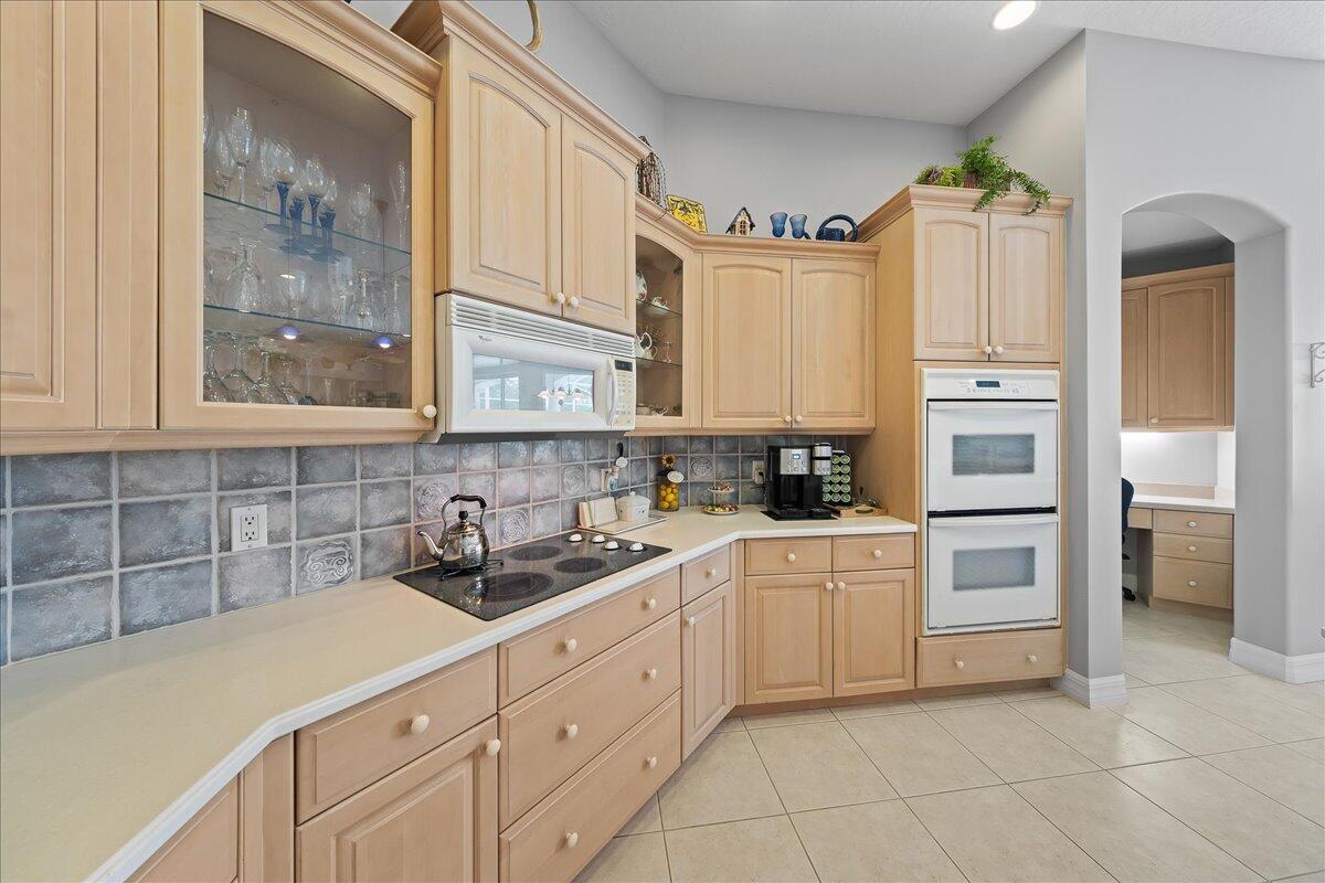 4300 Stoney Point Road Melbourne, FL 32940 - Photo 4 of 37 a kitchen with cabinets appliances and a window
