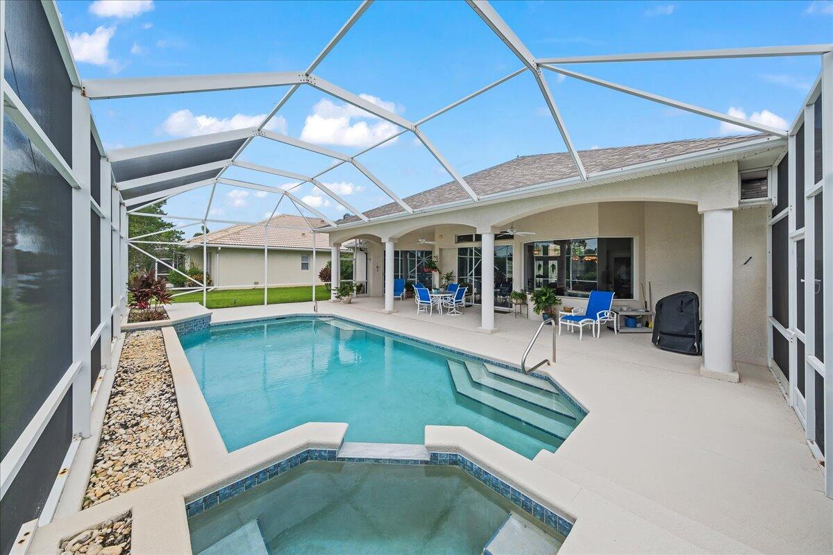 4300 Stoney Point Road Melbourne, FL 32940 - Photo 6 of 37 a view of a swimming pool with a patio