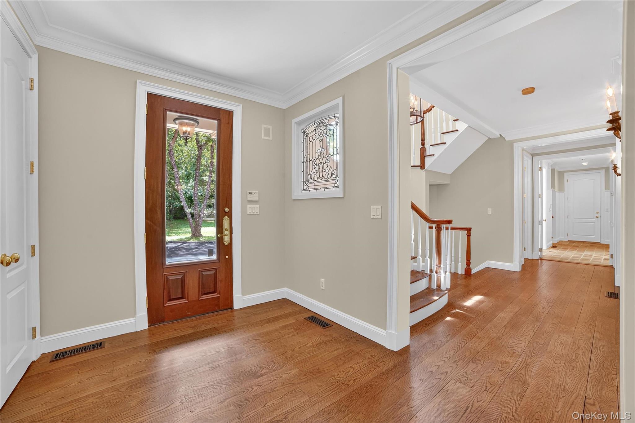 6 Todd Road Katonah, NY 10536 - Photo 6 of 50 Entrance foyer with crown molding, wood finished floors