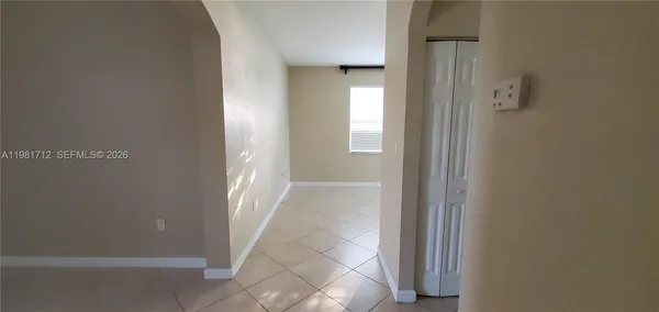 an aerial view of a house with a swimming pool