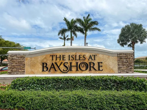 an aerial view of a house with garden space and lake view