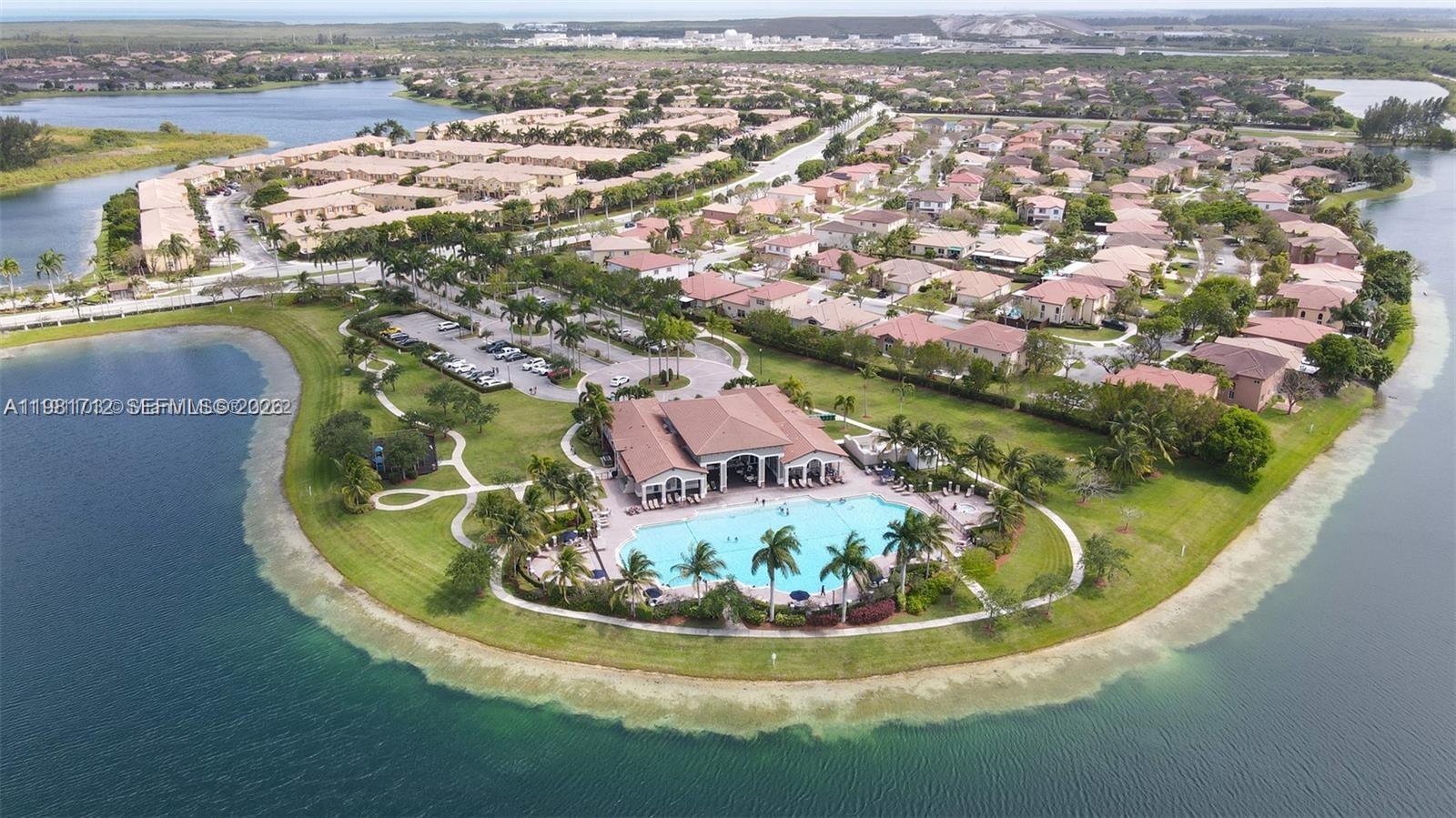 9267 Southwest 227th Street, Unit 2 Miami, FL 33190 - Photo 22 of 24 a view of a lake with a mountain