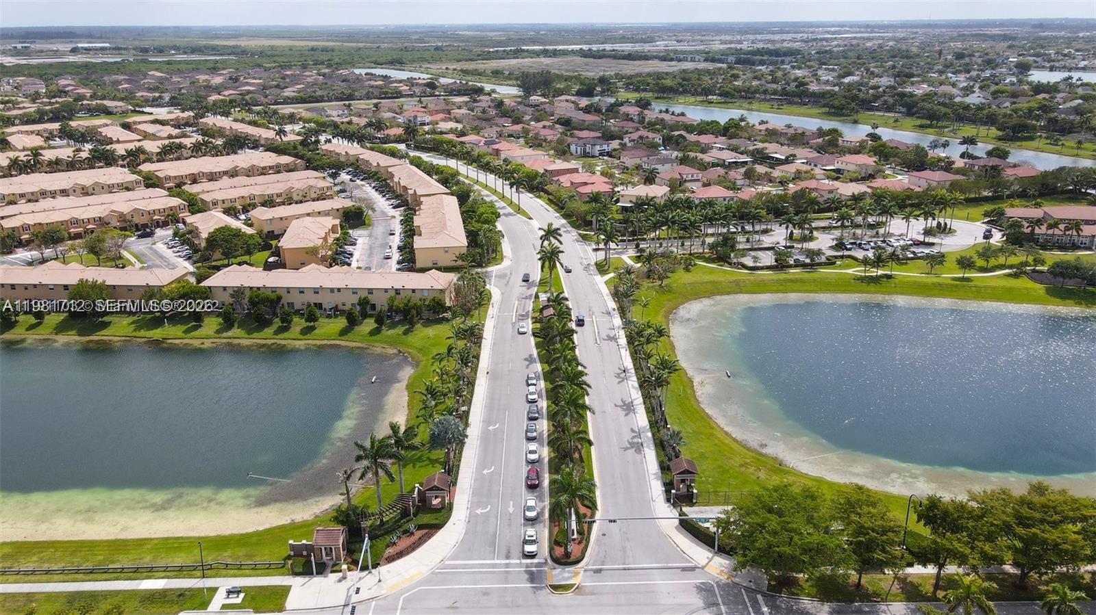 9267 Southwest 227th Street, Unit 2 Miami, FL 33190 - Photo 24 of 24 an aerial view of residential houses with outdoor space