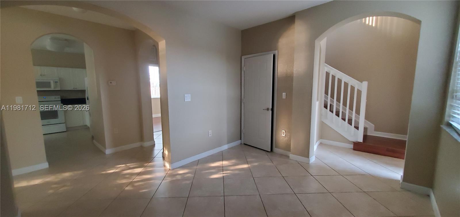 9267 Southwest 227th Street, Unit 2 Miami, FL 33190 - Photo 9 of 24 a view of a hallway with a bathroom