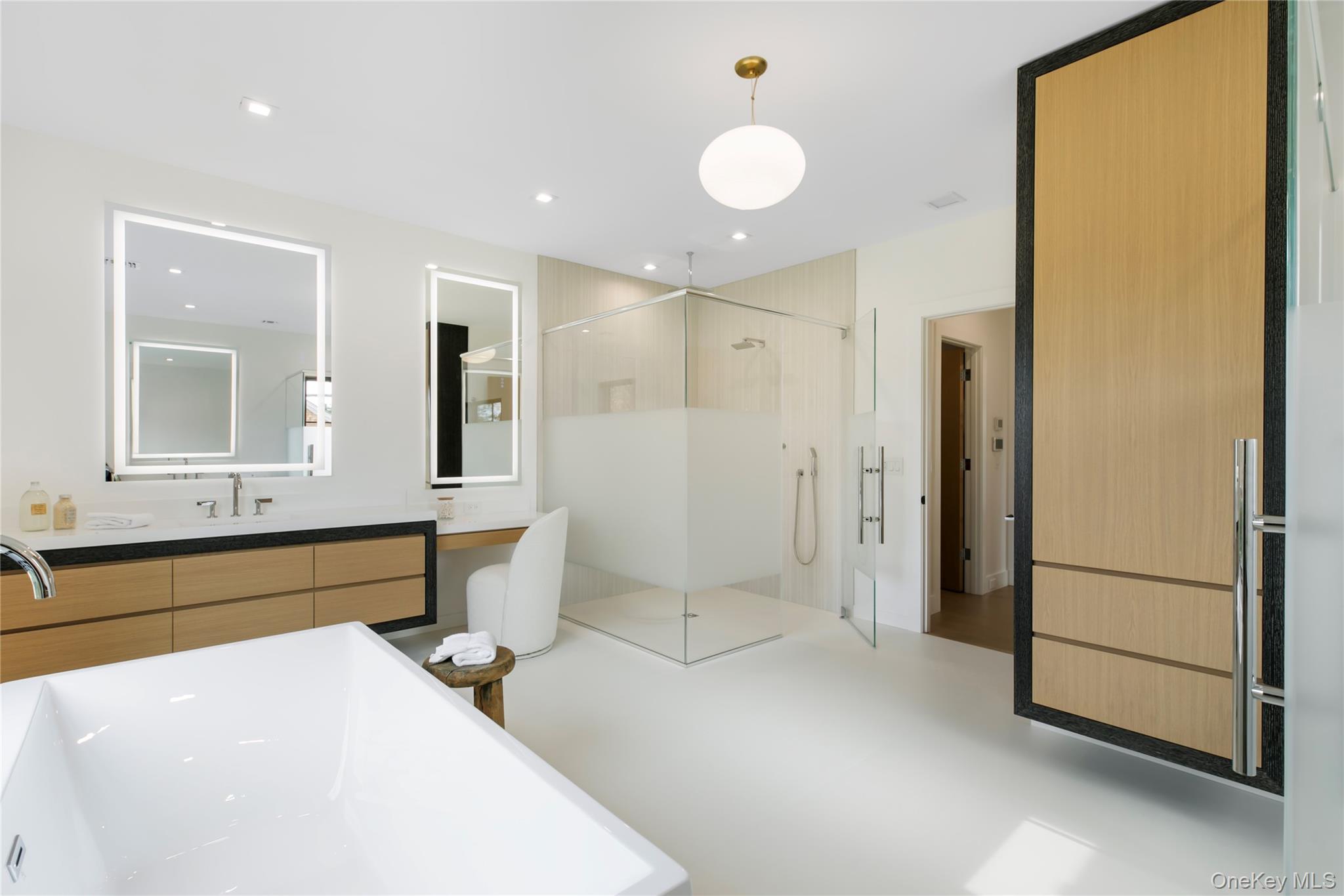 158 Cobb Road Water Mill, NY 11976 - Photo 22 of 43 Full bathroom with a soaking tub, vanity, a shower stall, recessed lighting, and concrete floors