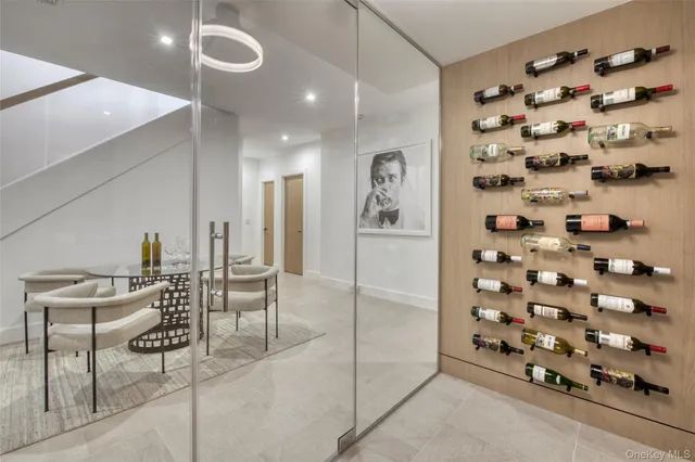 a dining room with furniture and a chandelier