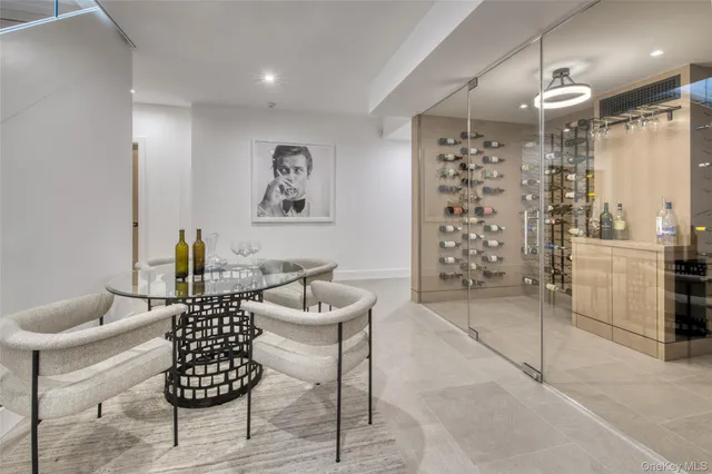 a dining room with furniture and a chandelier