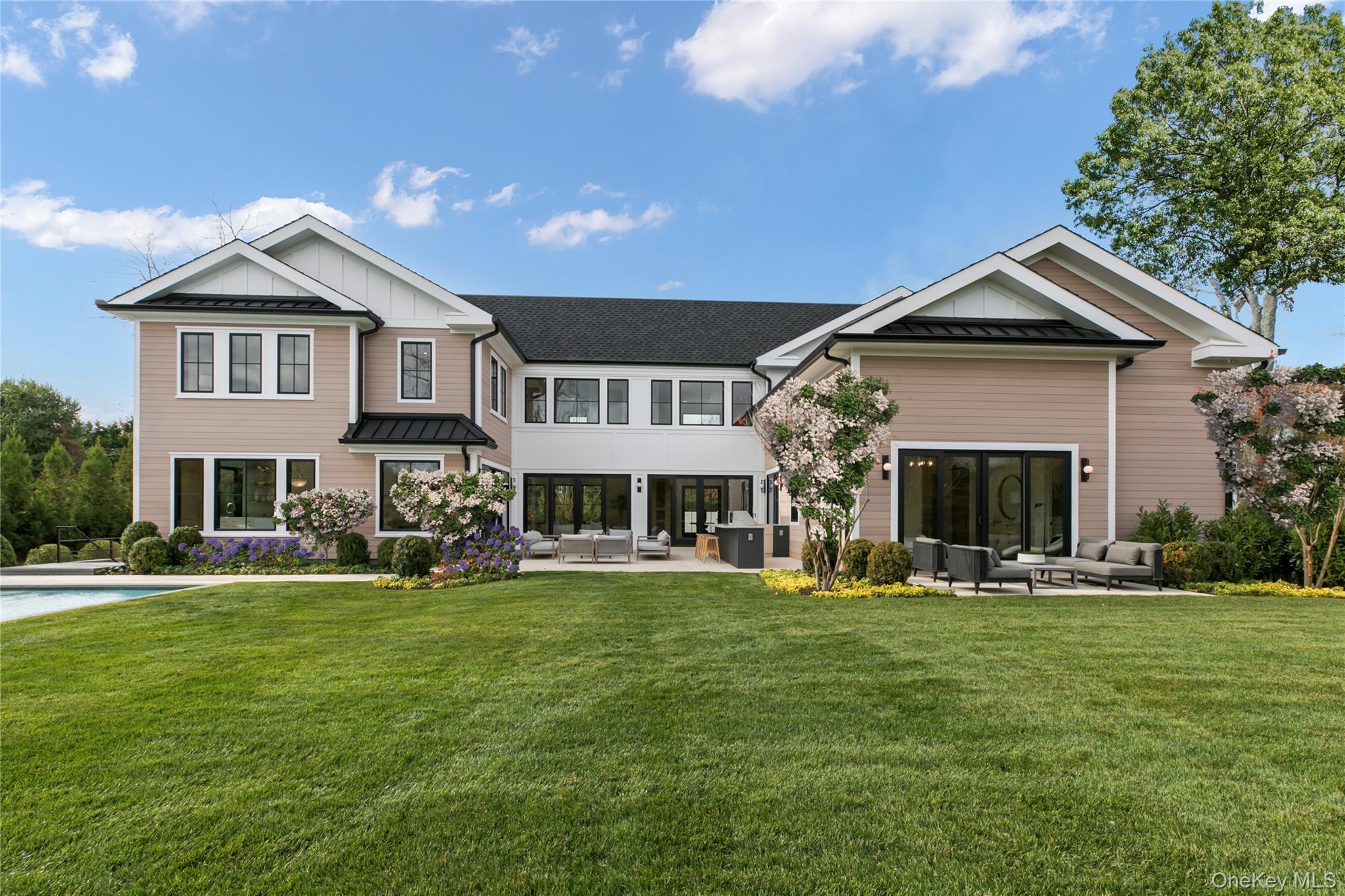 158 Cobb Road Water Mill, NY 11976 - Photo 39 of 43 Rear view of property featuring a standing seam roof, a patio, a metal roof, and an outdoor hangout area