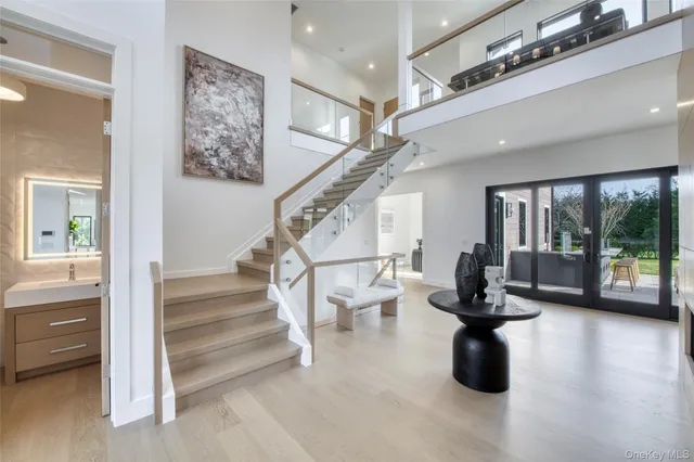 a view of entryway and hall with wooden floor