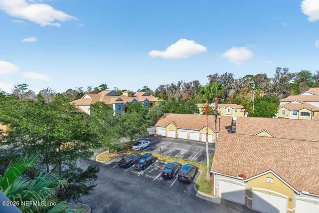 a view of a hallway with wooden shelves