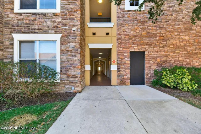 a front view of a building with a street