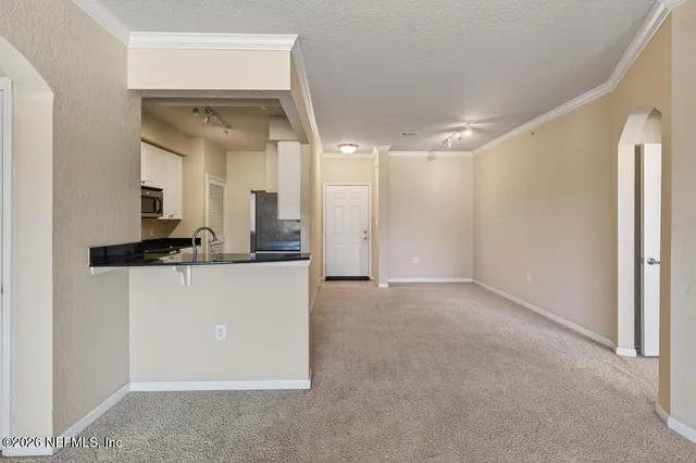 a kitchen with cabinets and a stove top oven