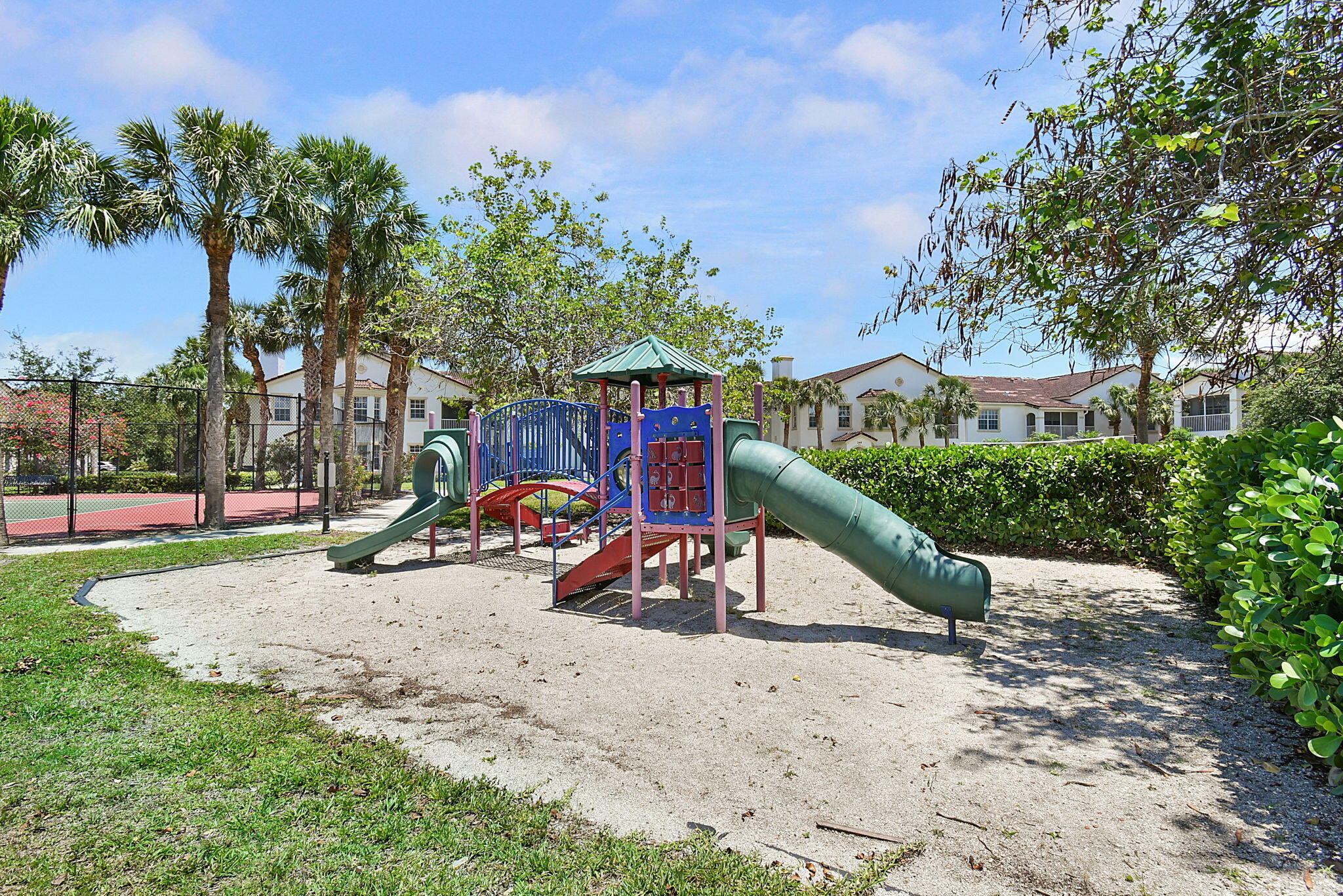 174 Southeast Kitching Circle, Unit 174 Stuart, FL 34994 - Photo 32 of 40 a view of a park with large trees