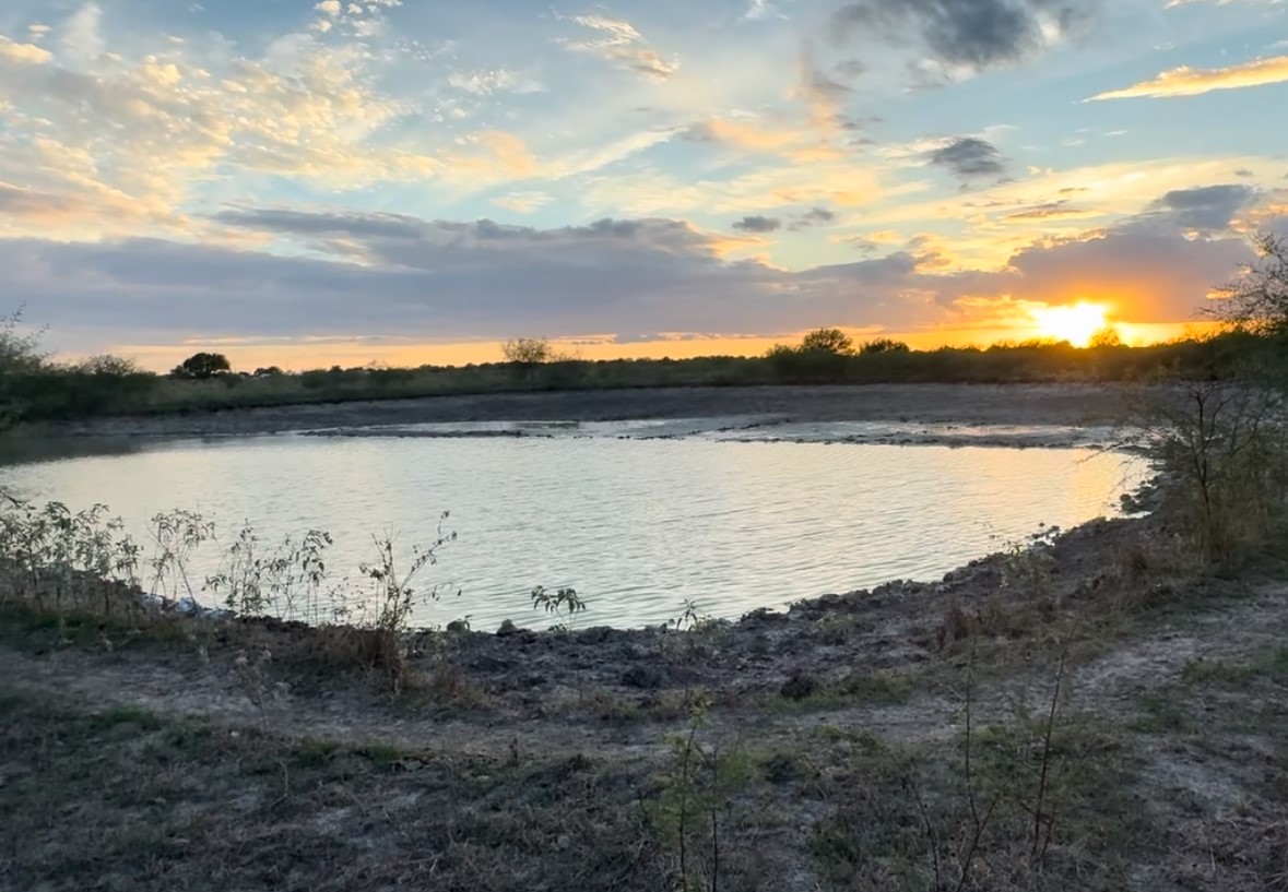 36847 Richard Frey Road, Unit 1 Hempstead, TX 77445 - Photo 12 of 14 a view of a lake with mountain in the background
