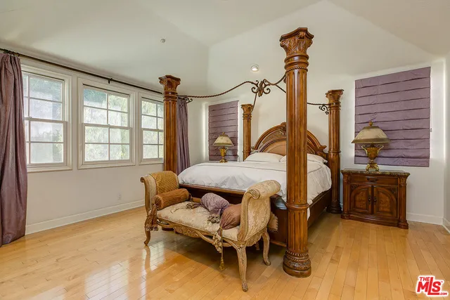 a bedroom with furniture and a window