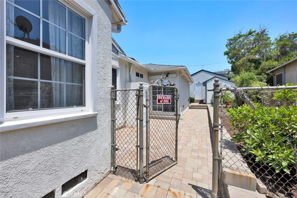 5456 Cadbury Road Whittier, CA 90601 - Photo 62 of 67 a view of a house with a small yard and large tree