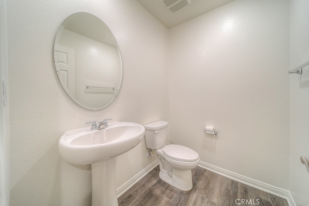 9596 Trailhead Lane Moreno Valley, CA 92557 - Photo 12 of 67 a bathroom with a sink and a mirror