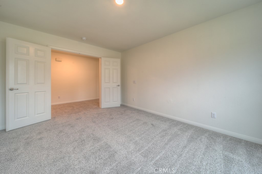 9596 Trailhead Lane Moreno Valley, CA 92557 - Photo 22 of 67 a view of an empty room and closet area