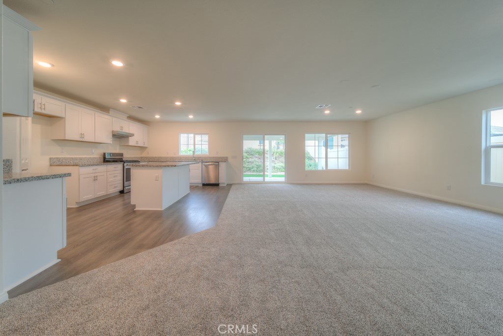 9596 Trailhead Lane Moreno Valley, CA 92557 - Photo 23 of 67 a view of empty room with kitchen and window