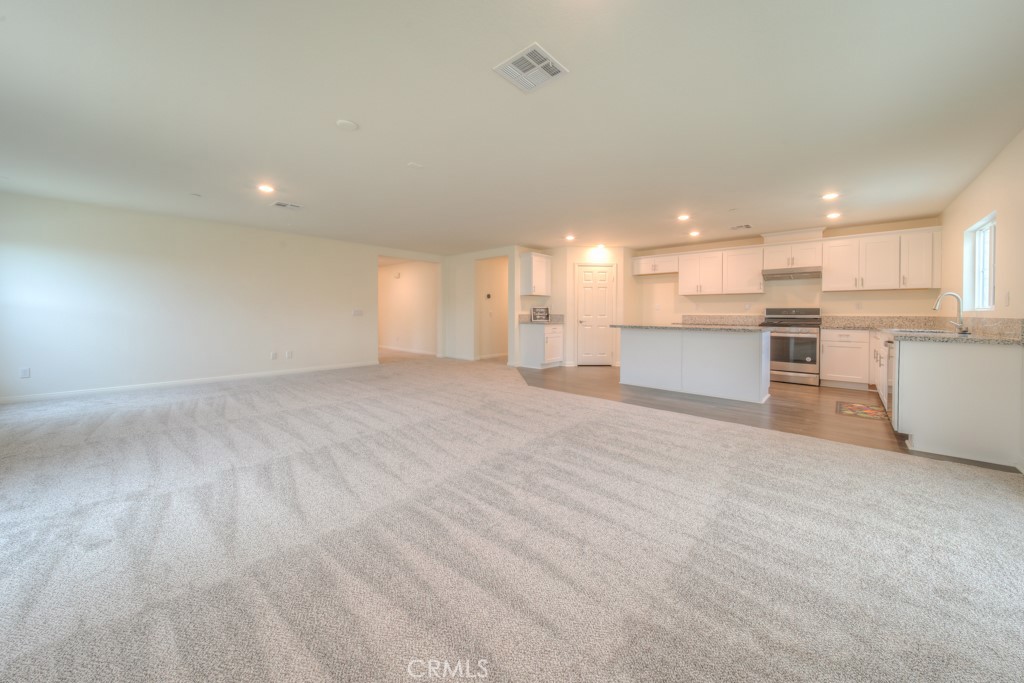 9596 Trailhead Lane Moreno Valley, CA 92557 - Photo 26 of 67 a view of a kitchen with a sink and cabinets