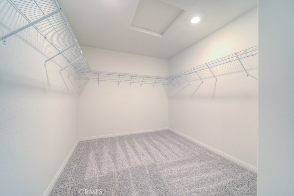 9596 Trailhead Lane Moreno Valley, CA 92557 - Photo 46 of 67 a view of a room with racks on the wall