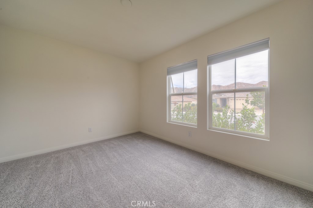 9596 Trailhead Lane Moreno Valley, CA 92557 - Photo 5 of 67 an empty room with a window