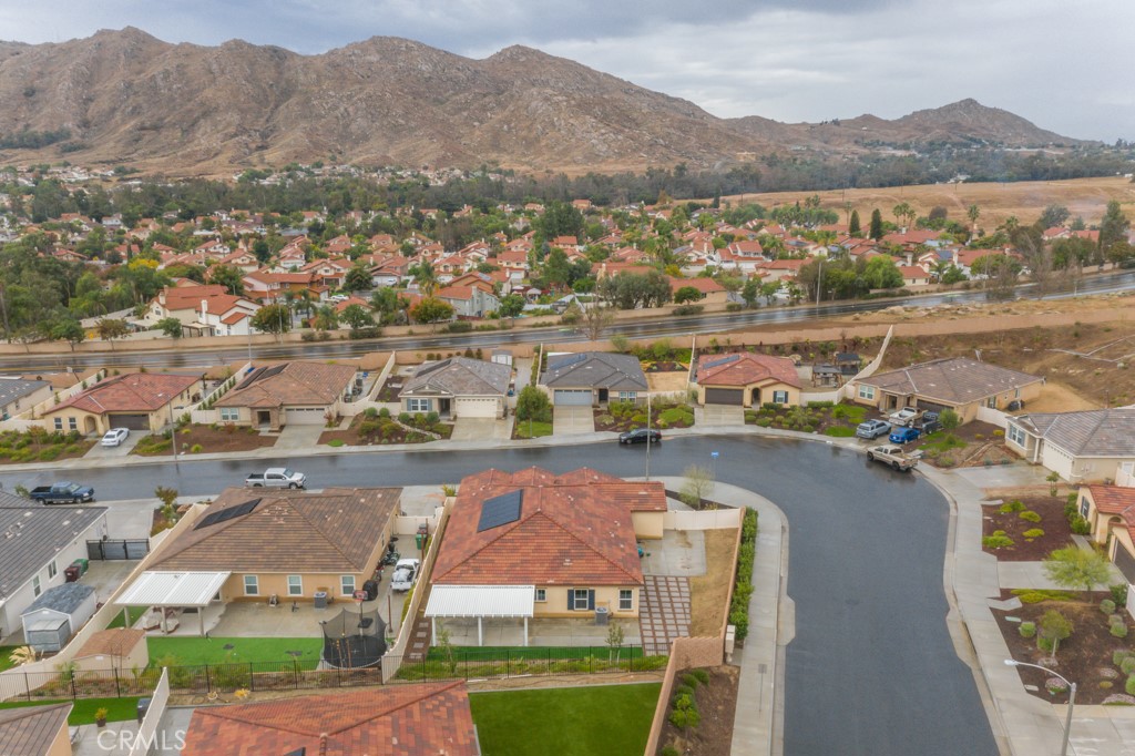 9596 Trailhead Lane Moreno Valley, CA 92557 - Photo 64 of 67 an aerial view of residential houses with outdoor space and river
