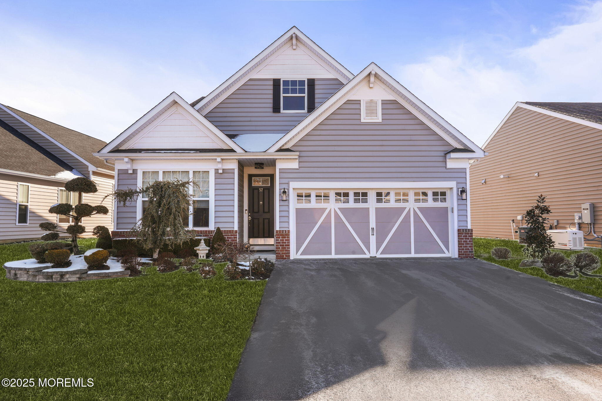 57 Harvest Ridge Road Howell, NJ 07731 - Photo 1 of 39 a front view of a house with a garden and patio