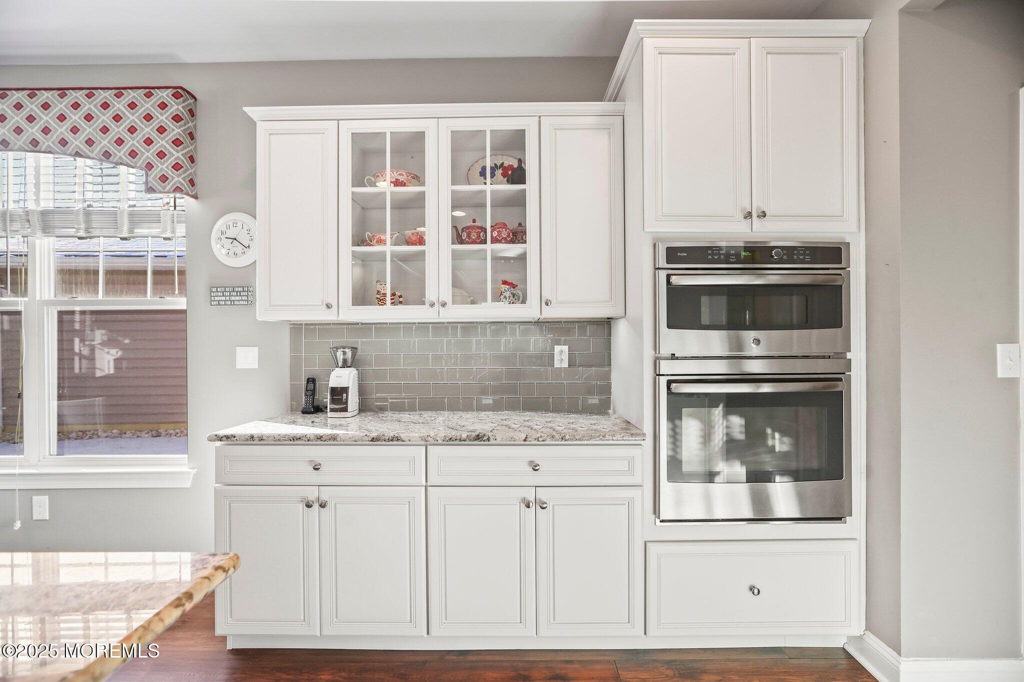 57 Harvest Ridge Road Howell, NJ 07731 - Photo 15 of 39 a kitchen with granite countertop a sink and cabinets