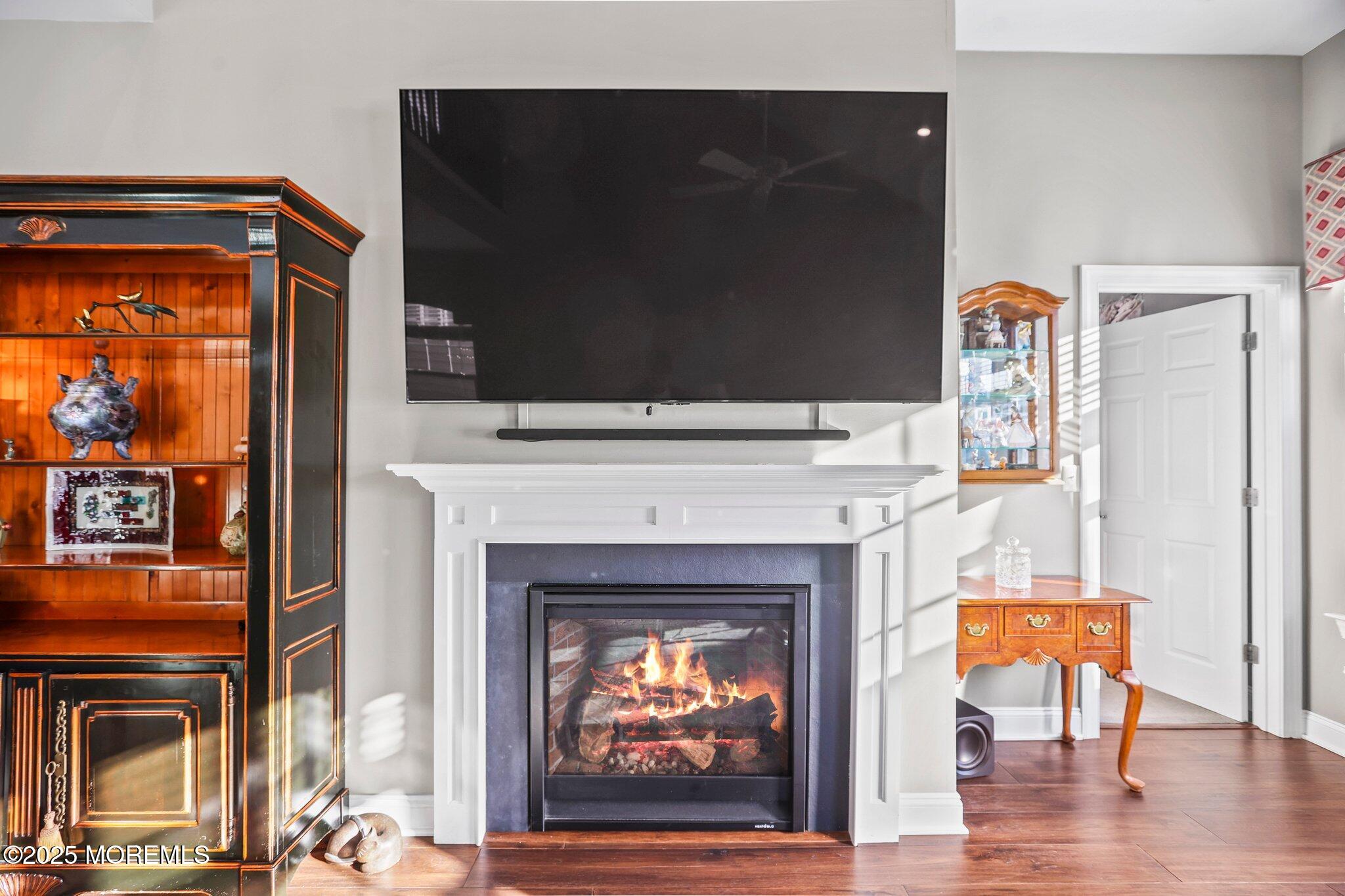 57 Harvest Ridge Road Howell, NJ 07731 - Photo 16 of 39 a living room with furniture and a fireplace