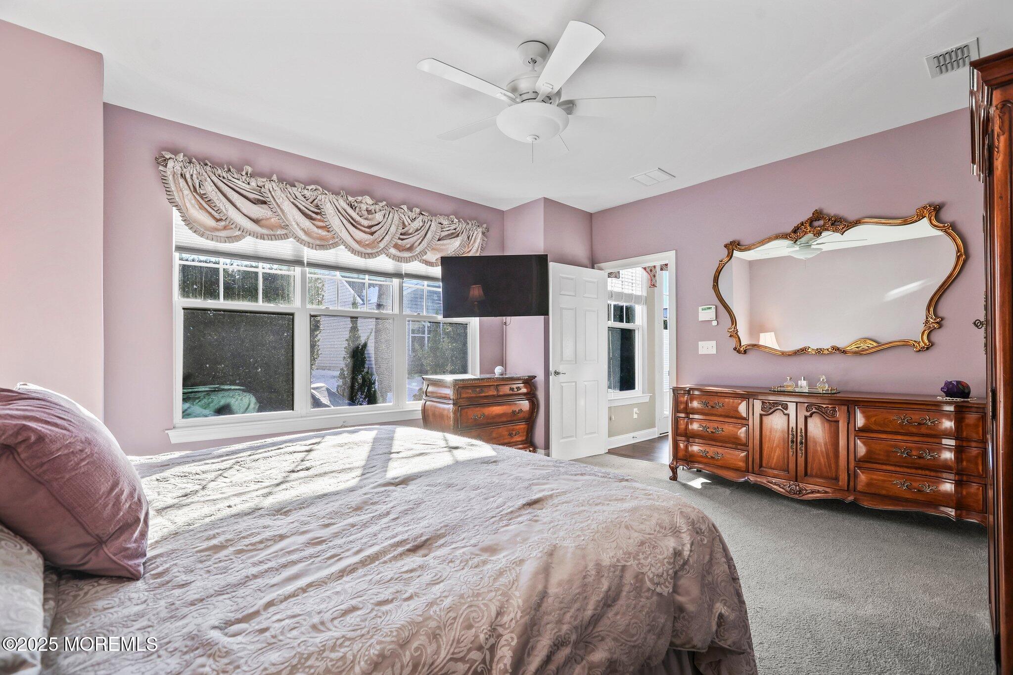 57 Harvest Ridge Road Howell, NJ 07731 - Photo 20 of 39 a bedroom with a bed and wooden floor
