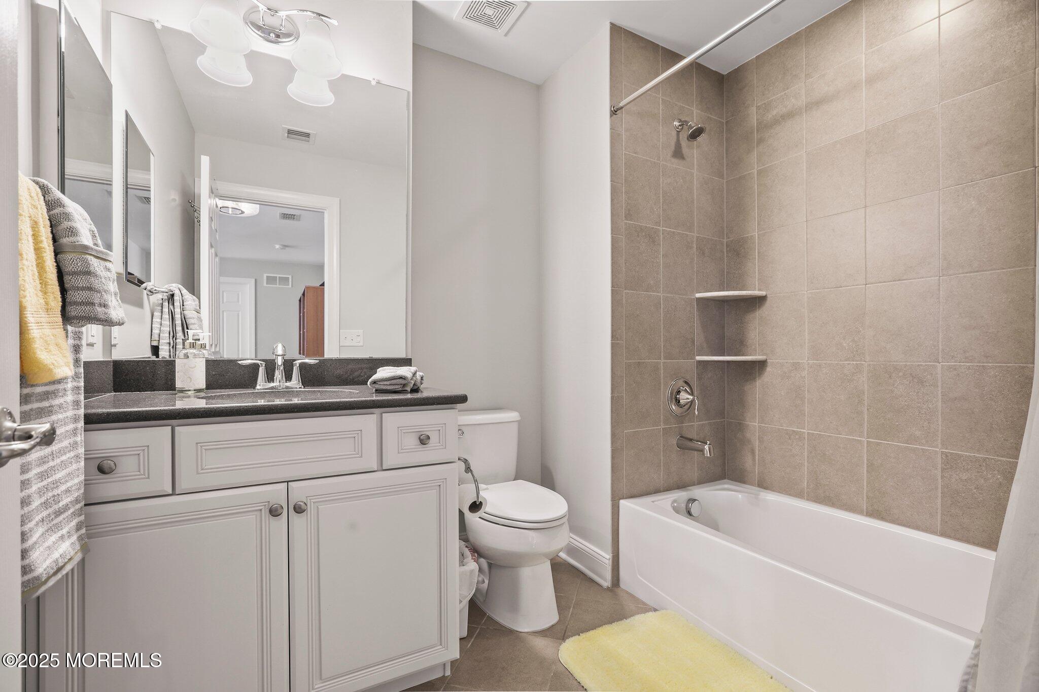 57 Harvest Ridge Road Howell, NJ 07731 - Photo 30 of 39 a bathroom with a sink a toilet and a bathtub