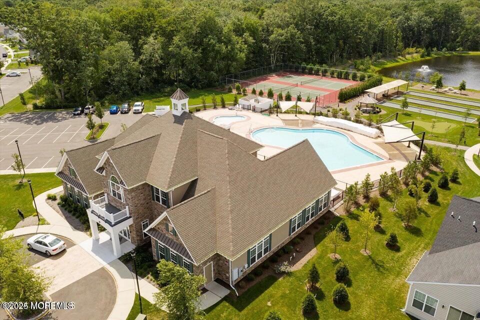 57 Harvest Ridge Road Howell, NJ 07731 - Photo 36 of 39 a view of a house with pool and chairs