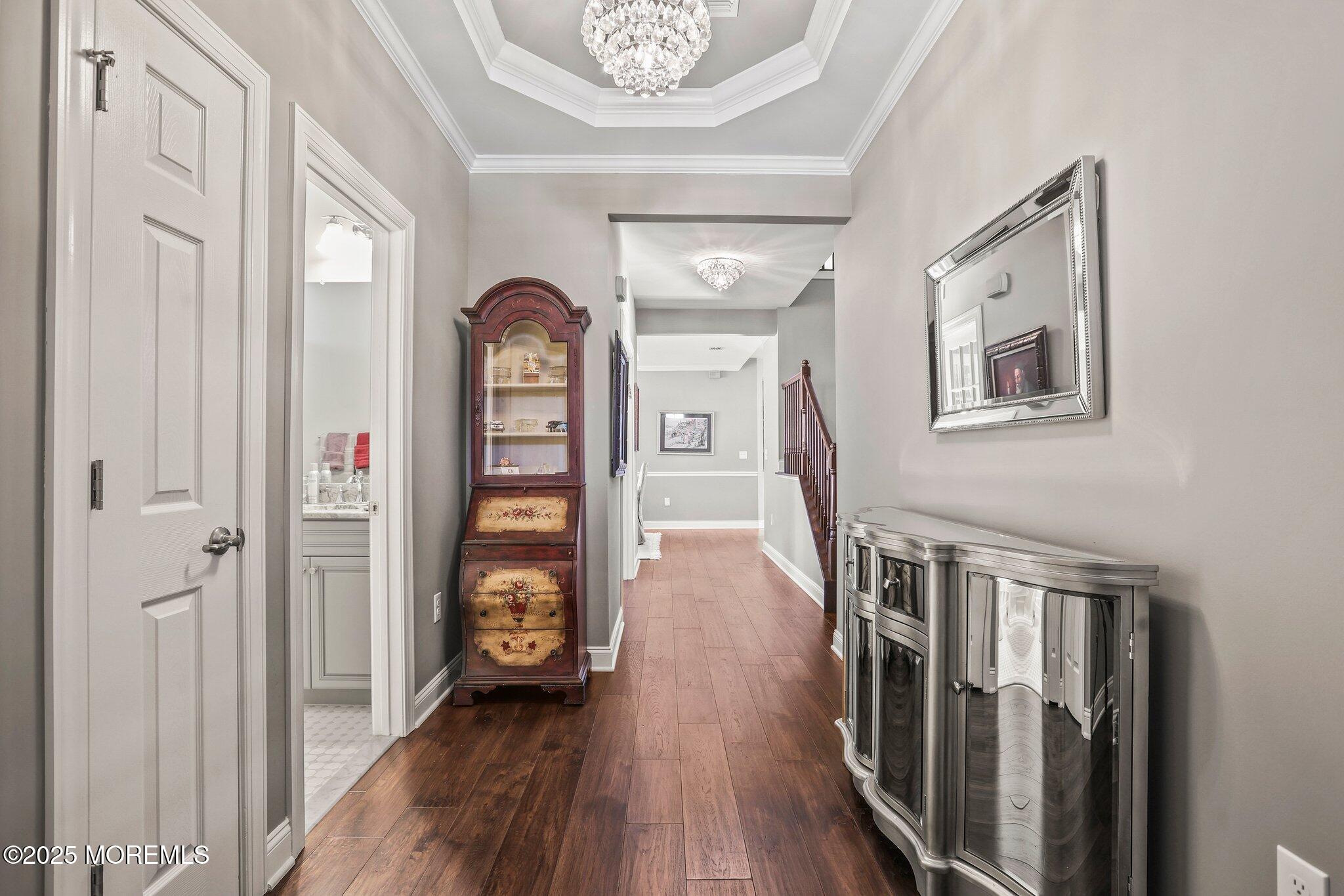 57 Harvest Ridge Road Howell, NJ 07731 - Photo 4 of 39 a view of a hallway with wooden floor and entryway