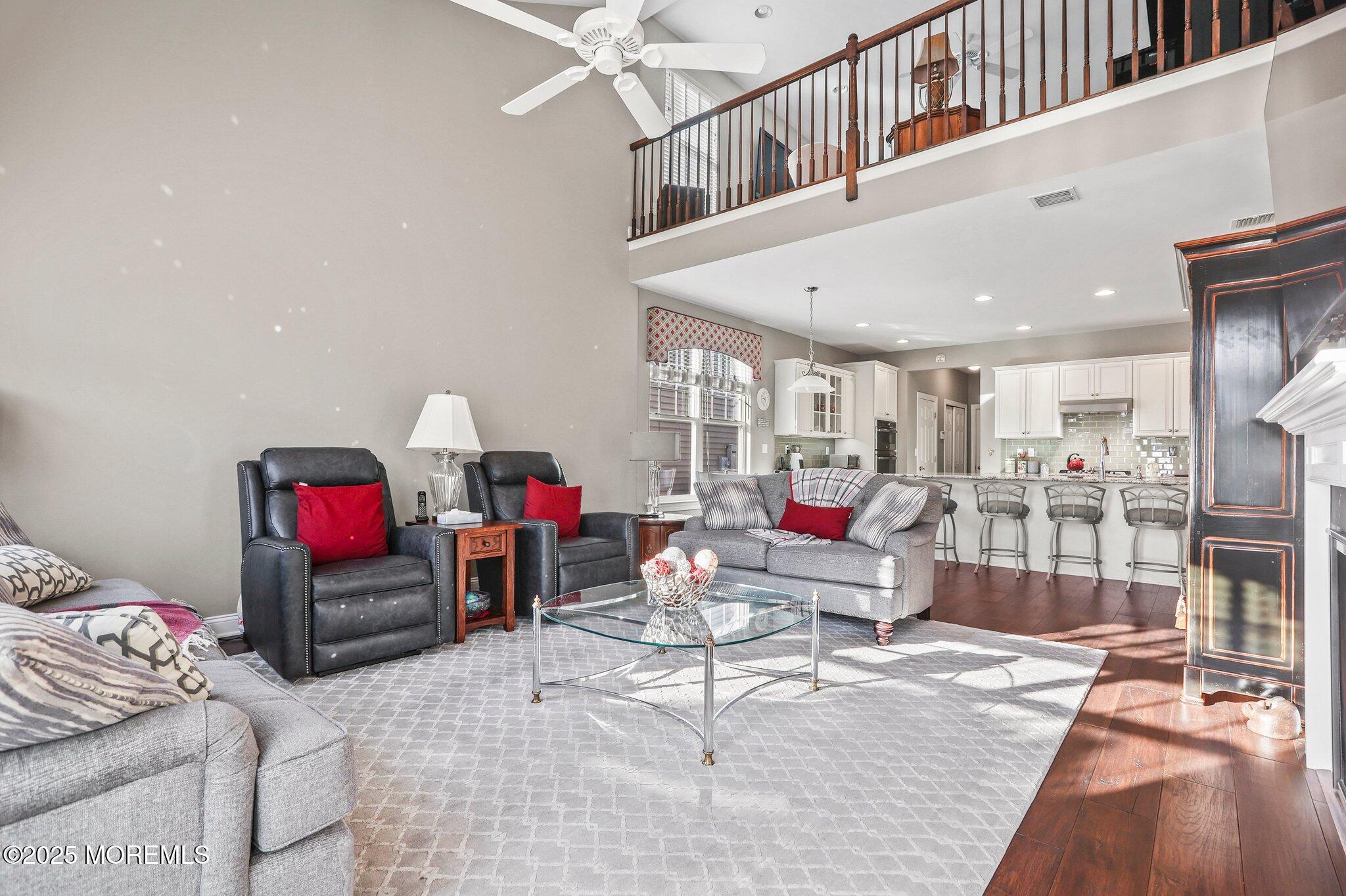57 Harvest Ridge Road Howell, NJ 07731 - Photo 6 of 39 a living room with furniture and wooden floor