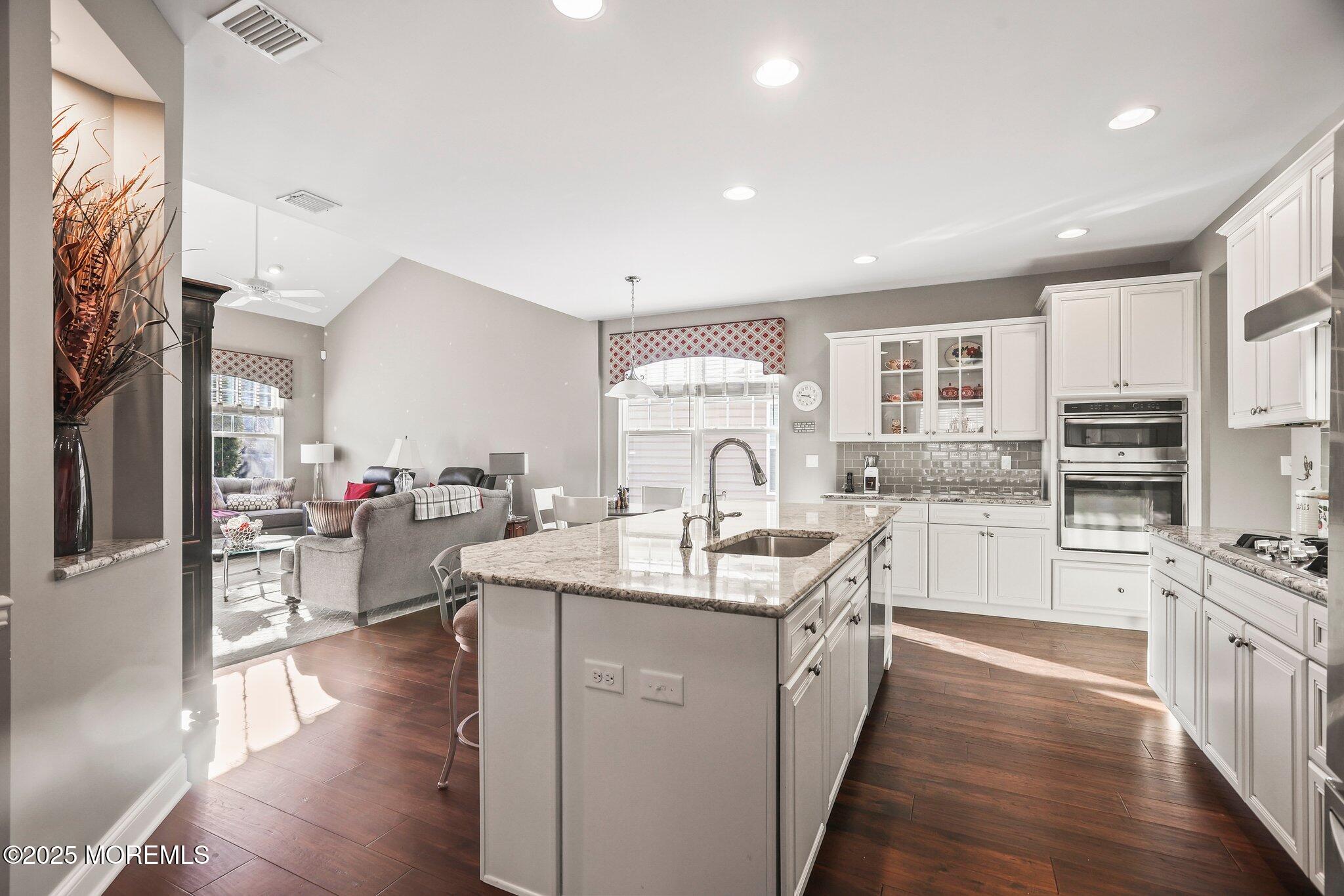 57 Harvest Ridge Road Howell, NJ 07731 - Photo 7 of 39 a kitchen with counter top space a sink appliances and cabinets